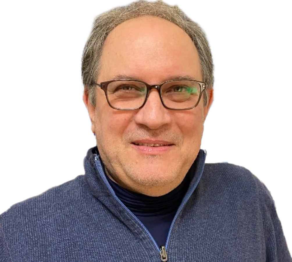 A man wearing glasses and a blue sweater